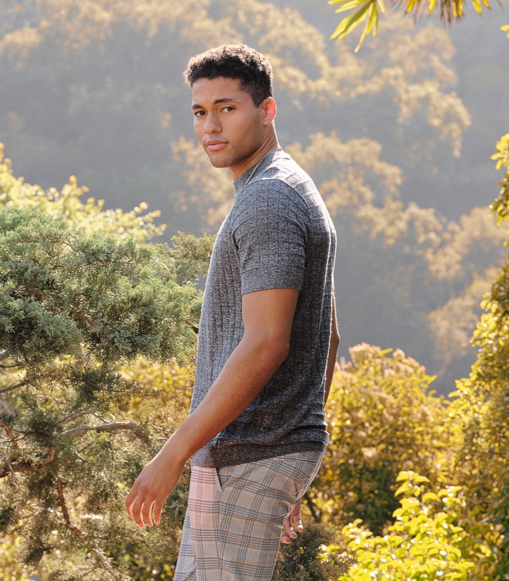 man standing in the woods