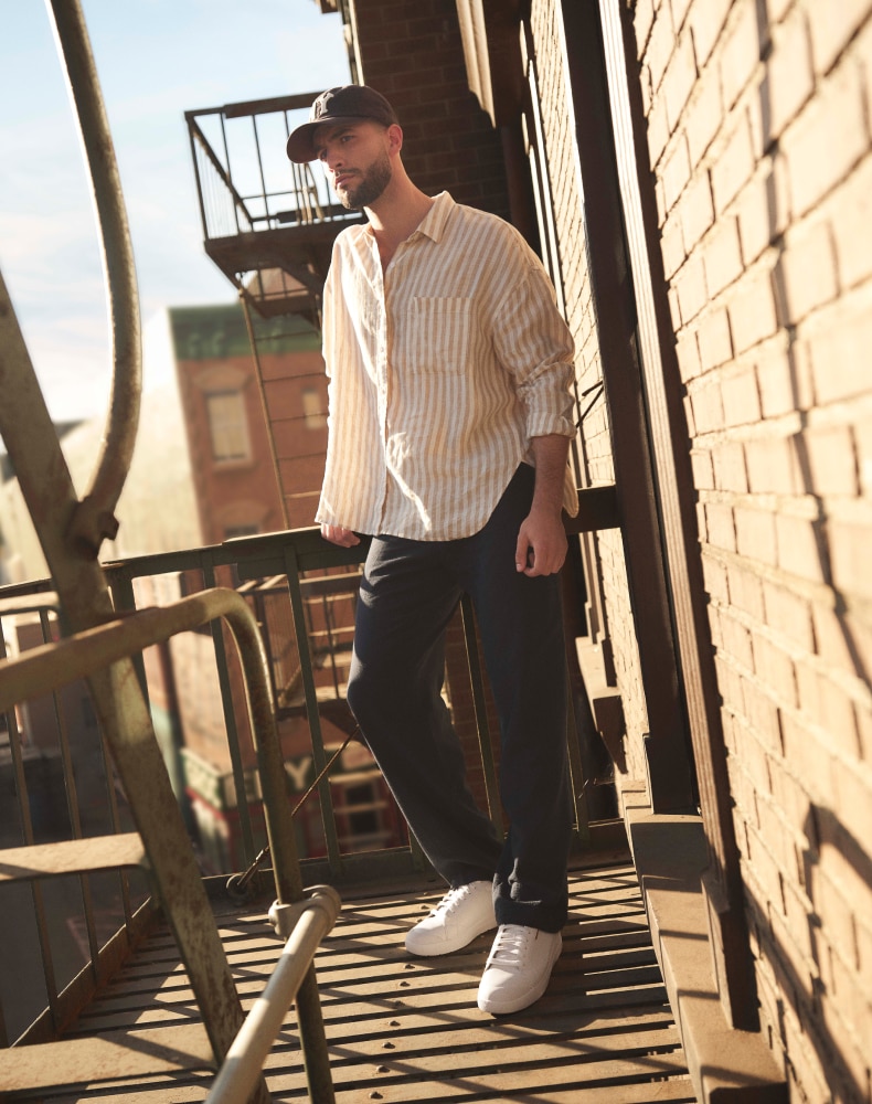 a man wearing the all white time off for men