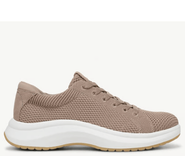 Side view of a women's plantar fasciitis sneaker in tan mesh fabric with a white sole. 